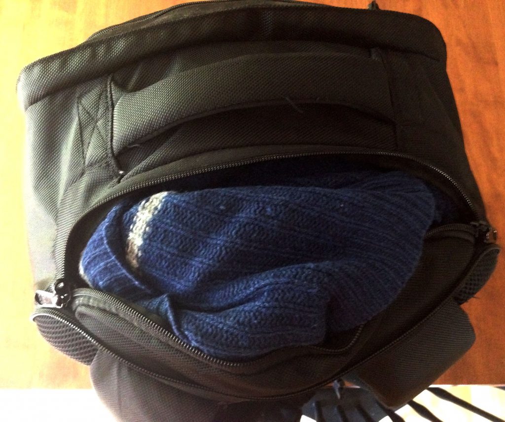 My wool Ravenclaw Quidditch sweater stuffed into the bag through the top zipper