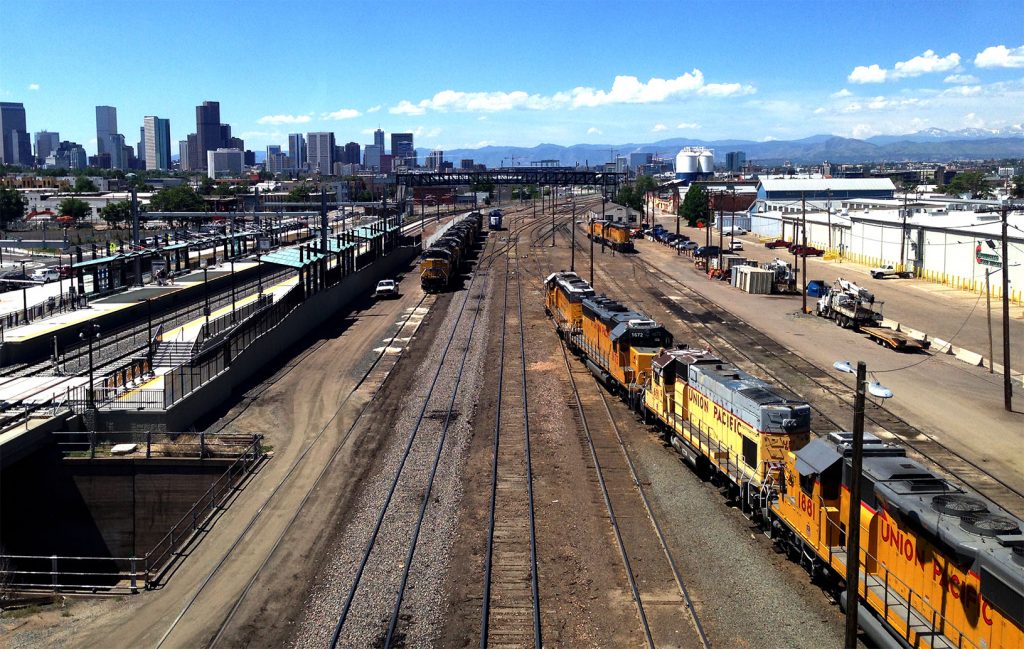 Train, skyline, and mountains - the Denver soul